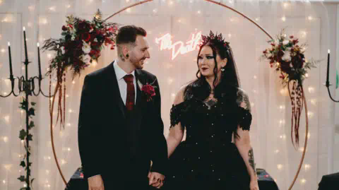 Tom Brossard Mathew and Hannah holding hands smiling